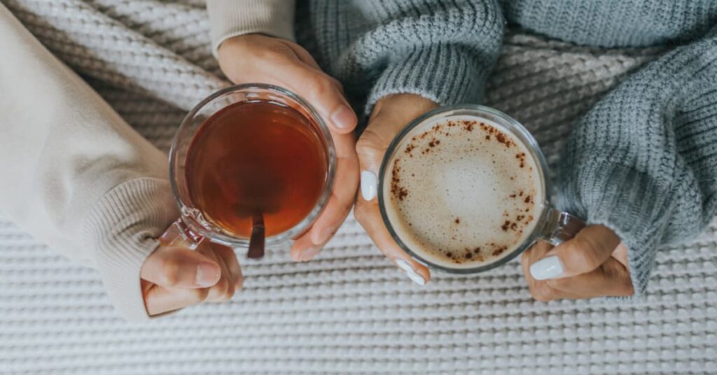 Holding two mugs