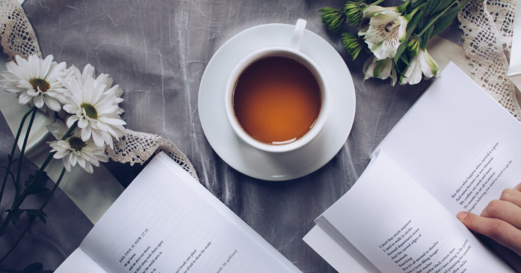 Mug of tea and open books