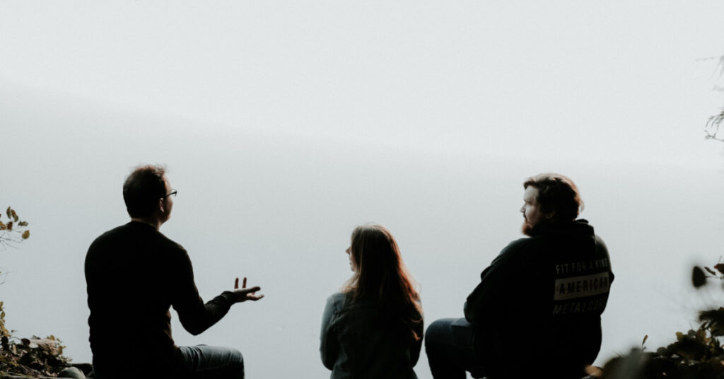 Three People Chatting